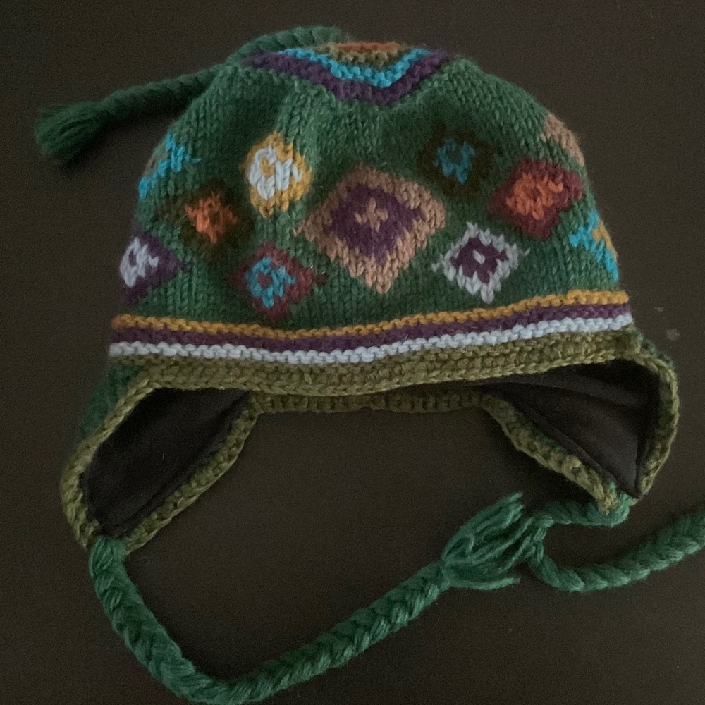 RISING TIDE WOOl KNIT WINTER HAT. With fleece lining and ear flaps. NWOT